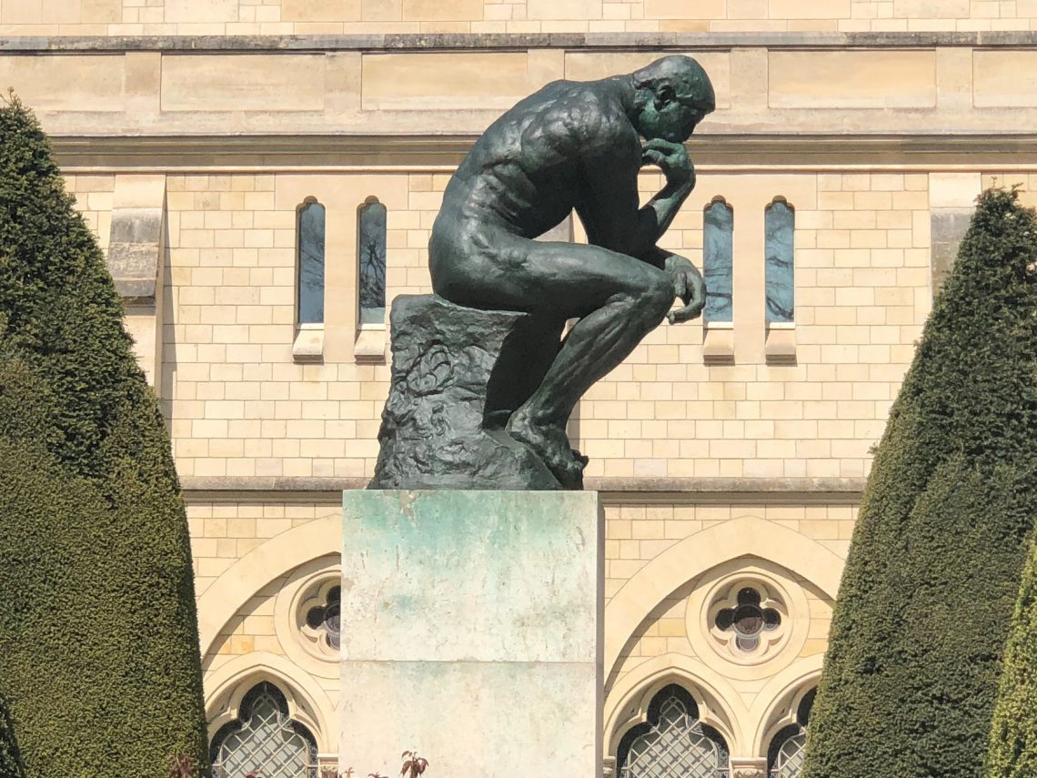 man sculpture in deep thought and contemplation